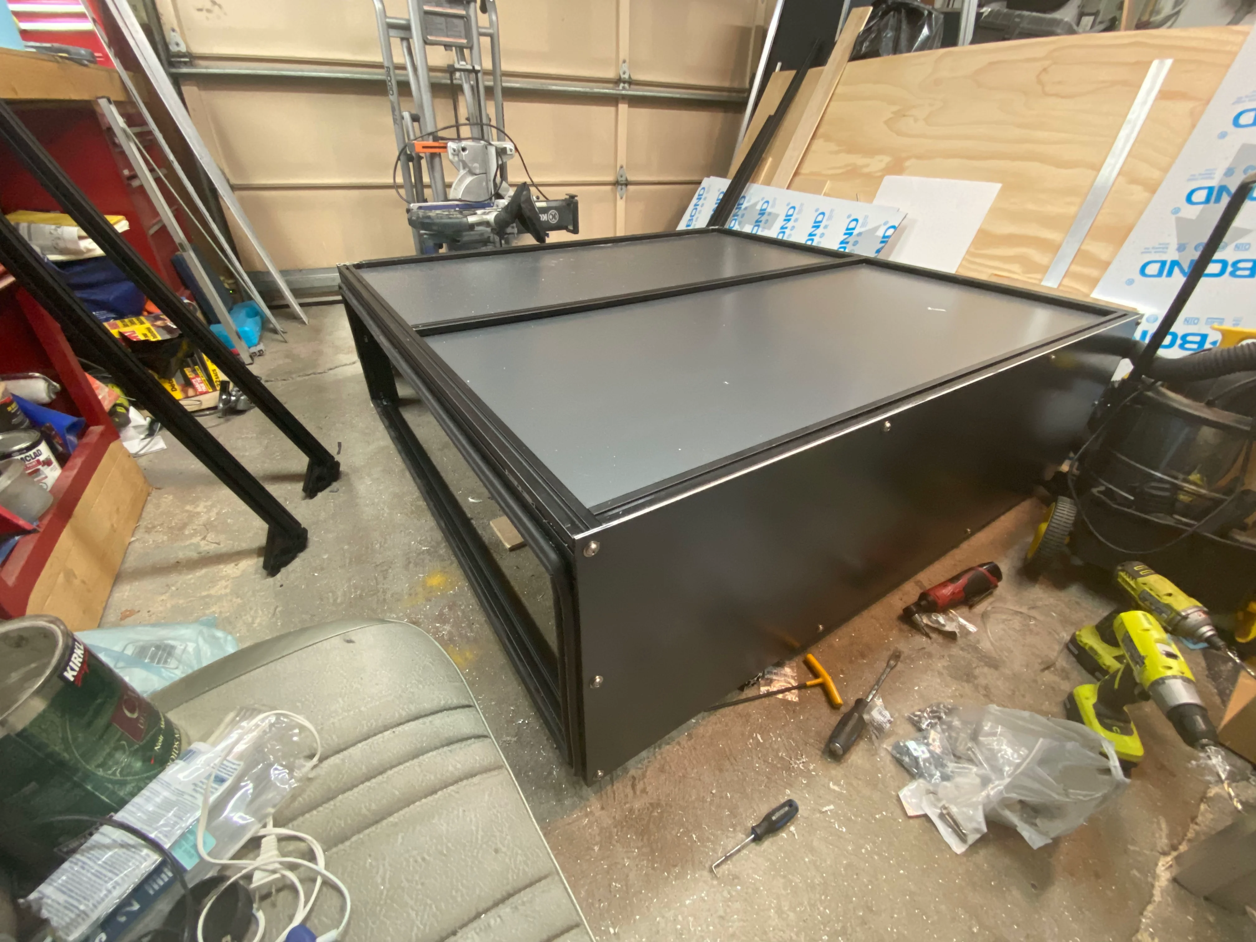 Roof panels with sealant in T-slot channels